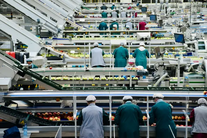 a group of men in a factory, Manufacturing